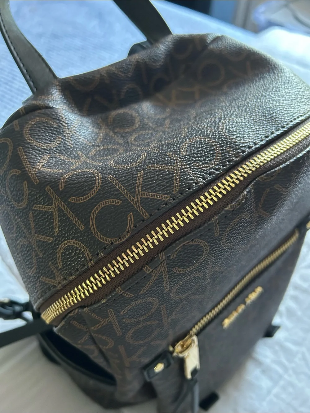 Calvin Klein Brown Monogram Logo Backpack with Gold Hardware